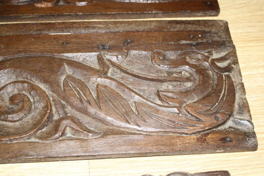 Three 19th century Continental carved oak corbels, carved with lion masks and a pair of scroll and dragon carved frieze panels